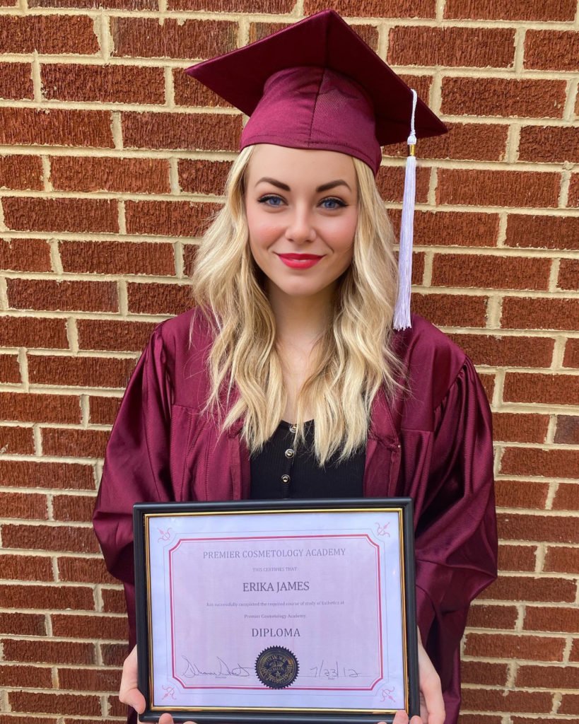 Erika James holding her Cosmetology Diploma