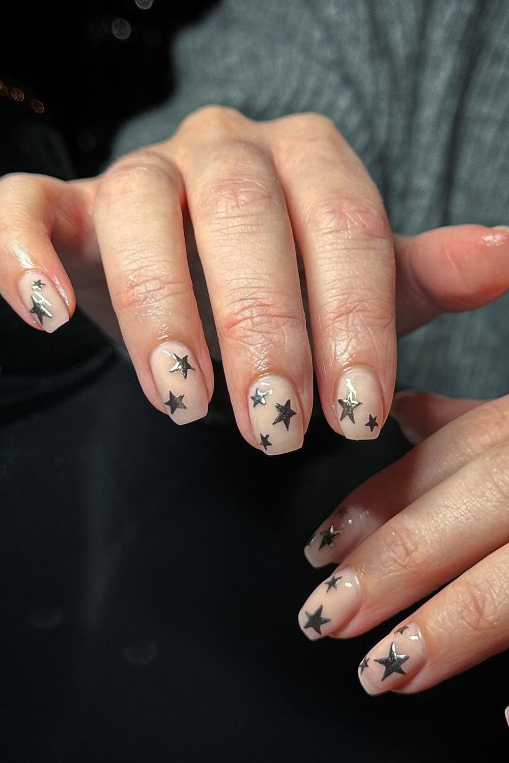 24 - Picture of Chrome Star Nails