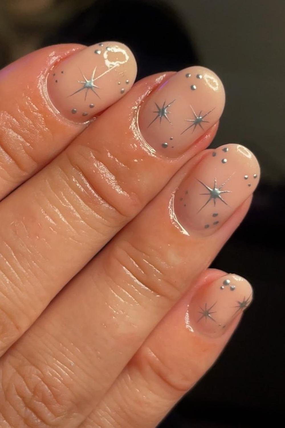 38 - Picture of Chrome Star Nails