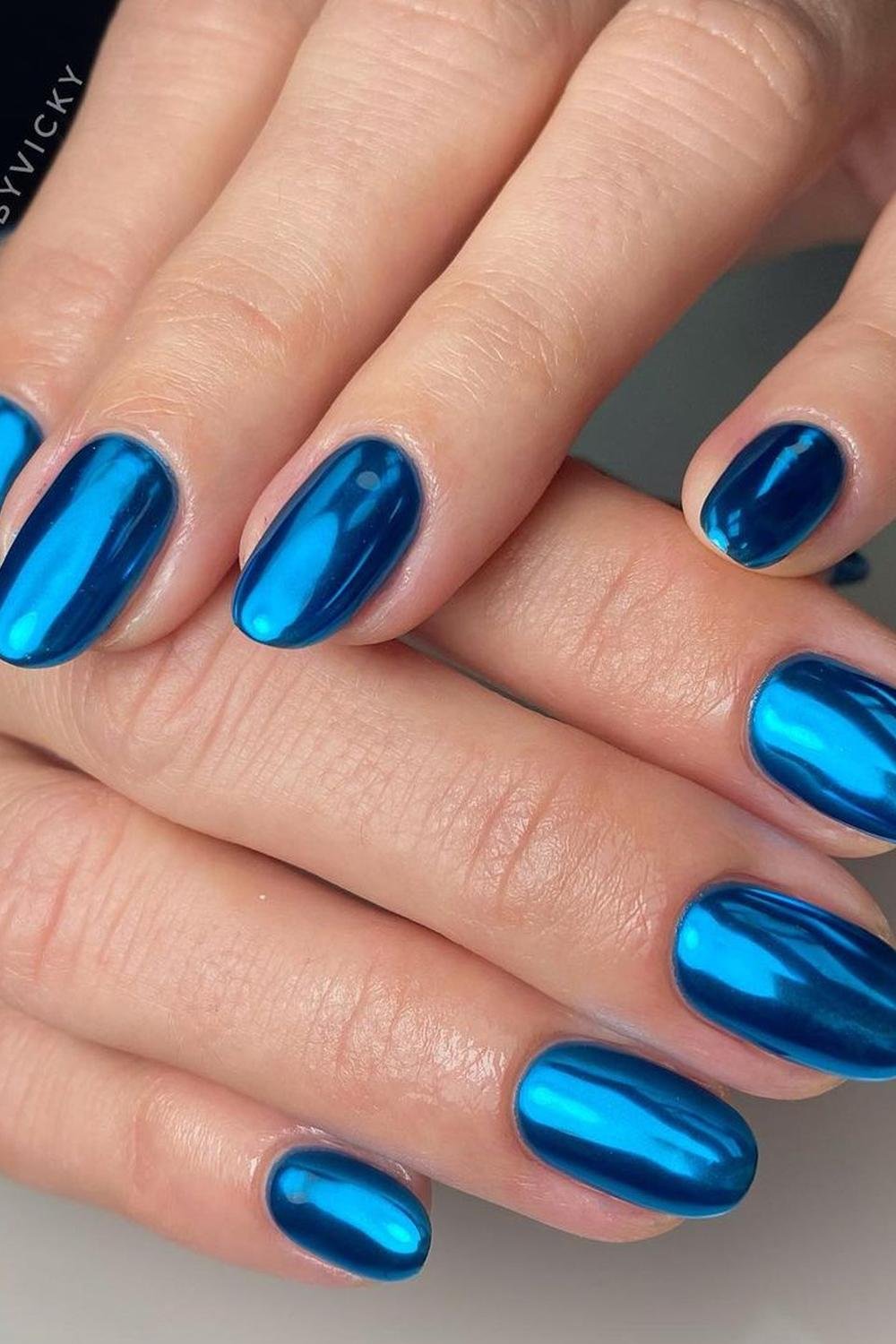 24 - Picture of Blue Chrome Nails